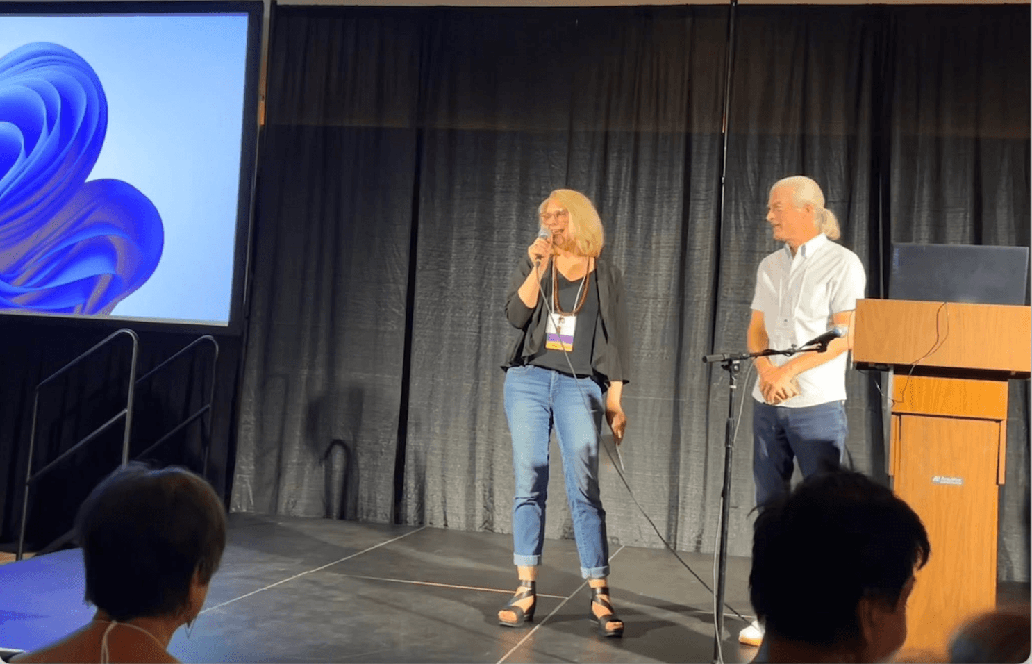 Dr. Angel Morgan and Dr. Kelly Bulkeley talking on stage